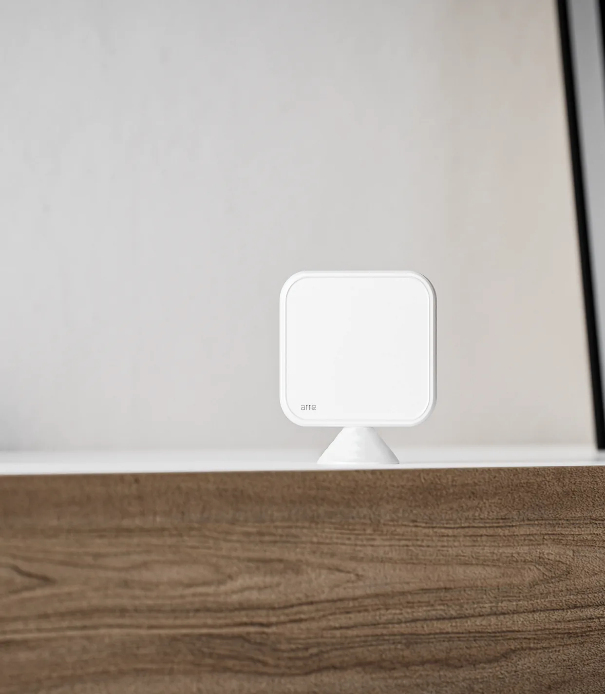 White arre Temperature Sensor on its removable stand