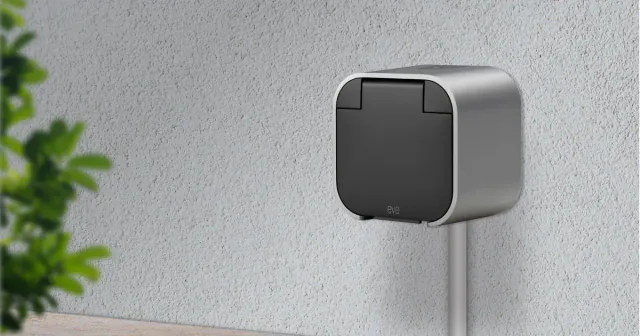 Gray Eve Energy Outdoor wall socket with its protective flap closed