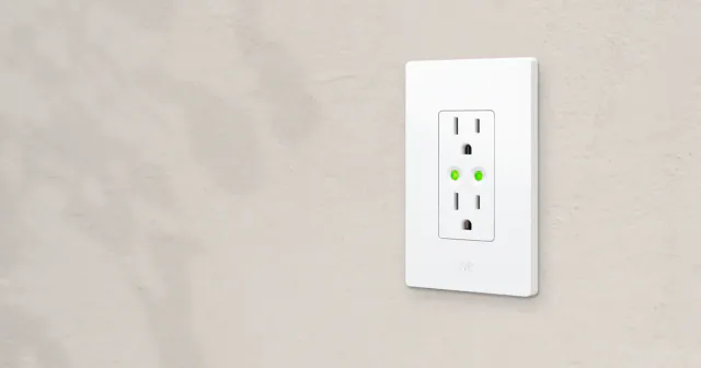 White Eve Energy Outlet with two grounded receptacles and separate green control buttons