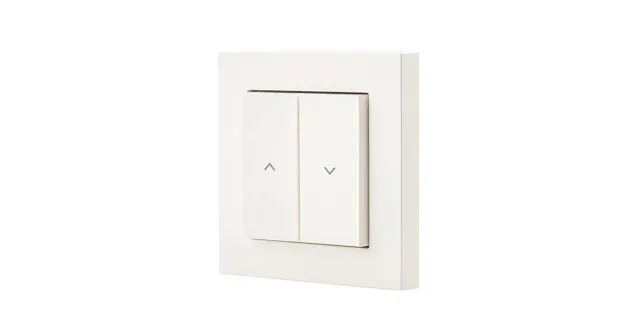 White Eve Shutter Switch with two broad up/down arrow buttons in a square wall frame