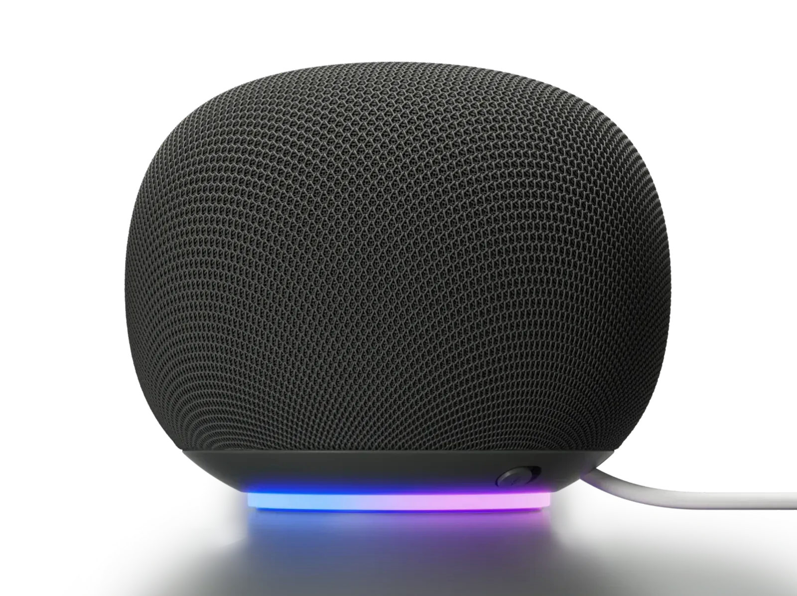 Google Home Speaker in Hazel showing its microphone switch, illuminated base and attached power cable