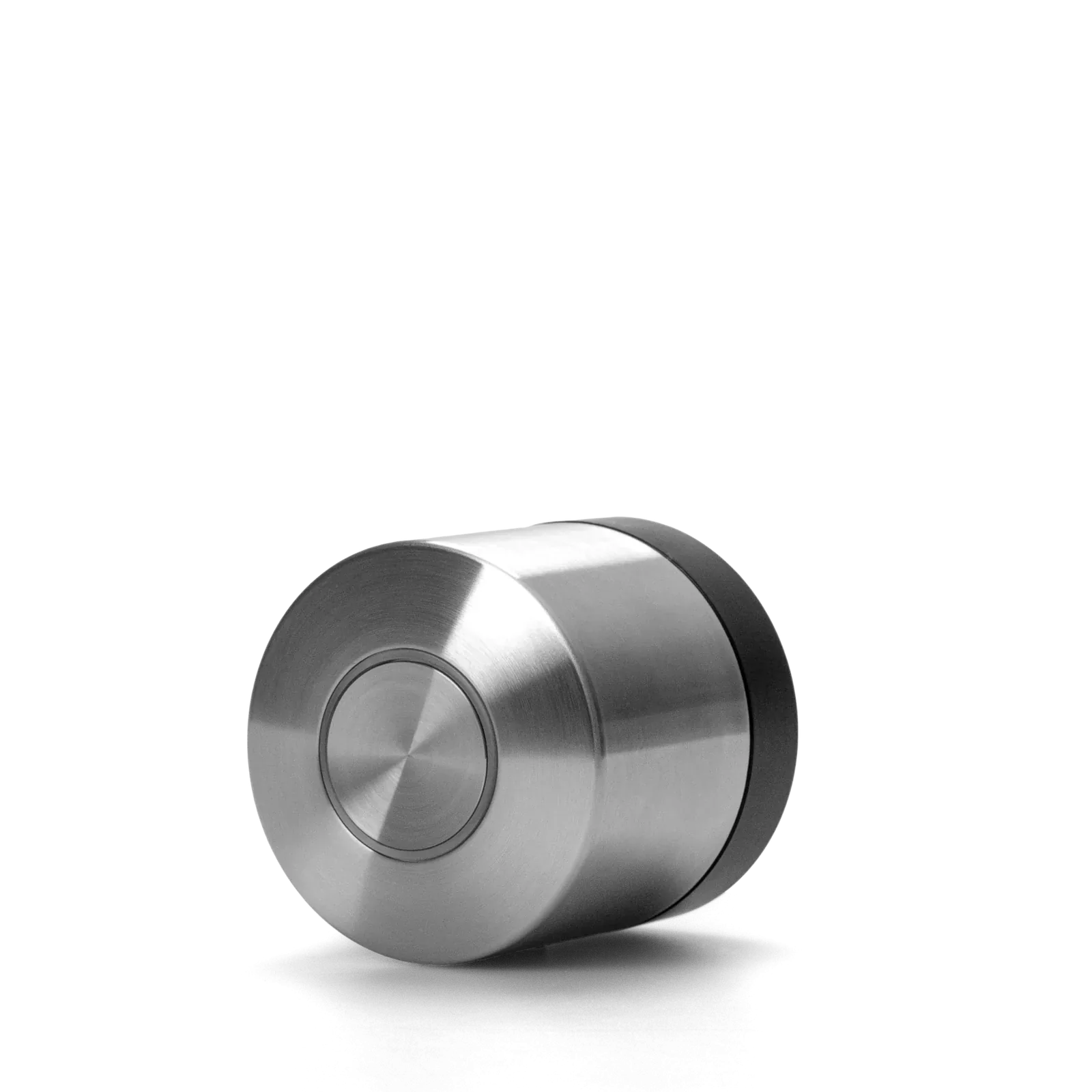 Stainless-steel Nuki US deadbolt retrofit motor with a black base ring