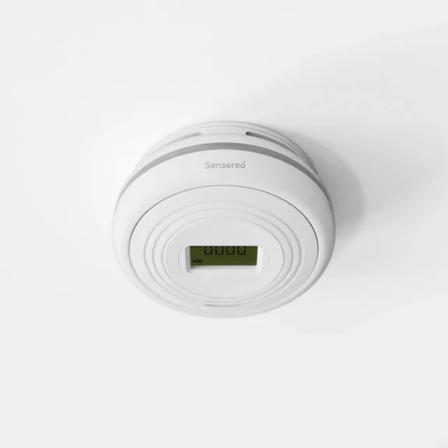 White Sensereo MSC-1 smoke and carbon monoxide alarm with a central LCD