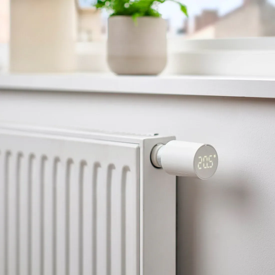 IKEA LILJEBAGGE smart radiator thermostat installed on a white radiator